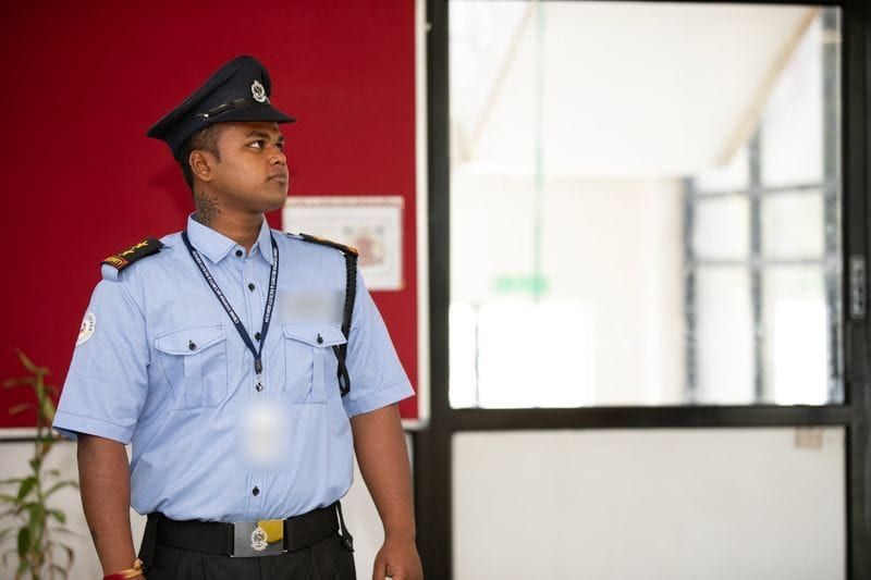 The uniform of a security guard: shirt, lanyard and belt